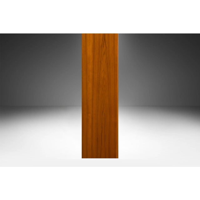 An exceptional teak tall bookcase. Gorgeous Mid-Century Modern Teak bookcase /77" tall bookshelf unit, manufactured by...