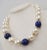 This is part of Chairish’s Costume Jewelry assortment. c. 1992 goldtone chunky mabe faux-pearl and faux-lapis necklace...