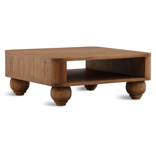 Warm hand carved solid wood square coffee table with a rich natural finish that highlights the beautiful grain. The open...