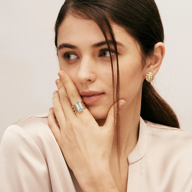 Created in 18 karat yellow gold Blue topaz 7 carats approx. Diamonds 0.25 carat approx. Ring size US 7, can be sized...