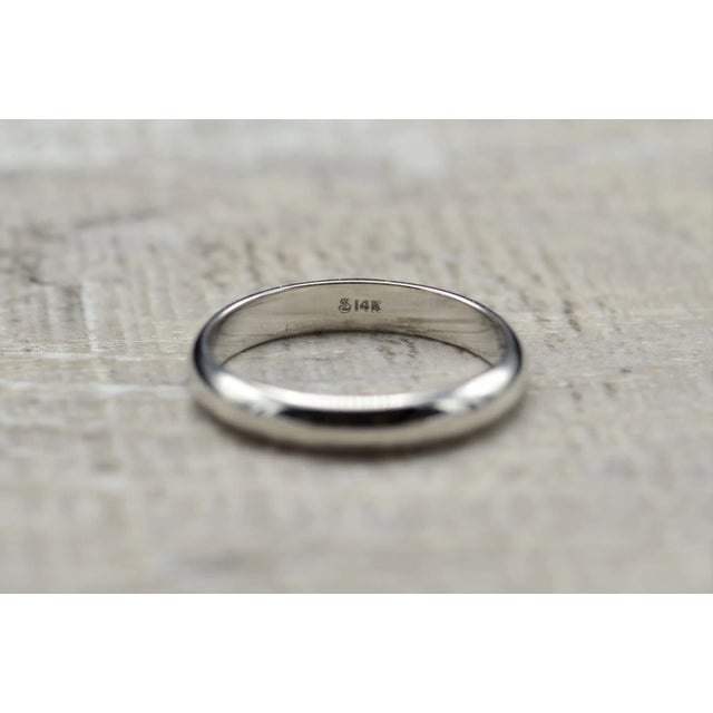 Ladies Classic 14K White Gold Wedding Band. Crafted in a high polished 14 karat white gold, this band measures 3mm in...