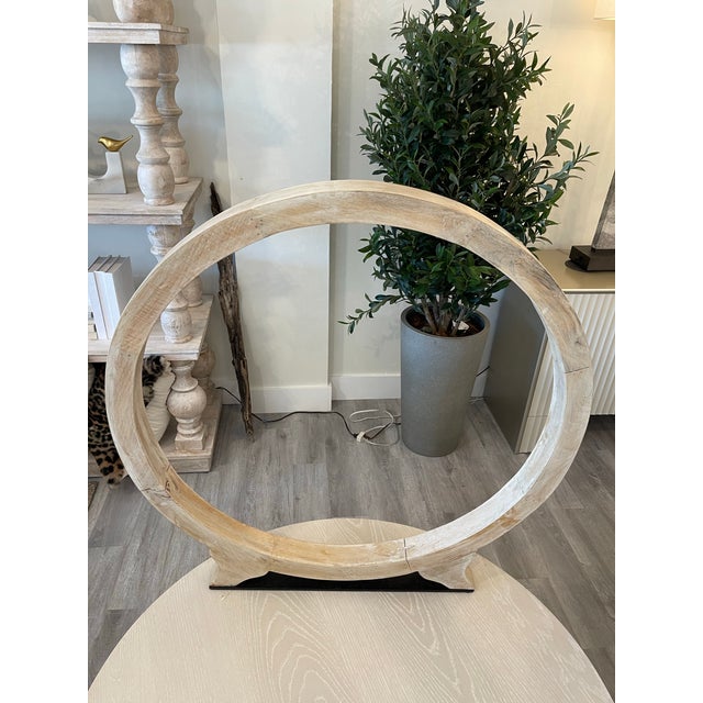 Elevate your space with this large light wood ring sculpture, featuring a striking single, elegantly crafted ring. The...
