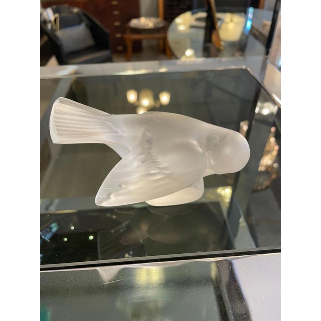 Beautiful satin-finished crystal sparrow figurine by Lalique. Crafted from high-quality frosted crystal, it reflects the...