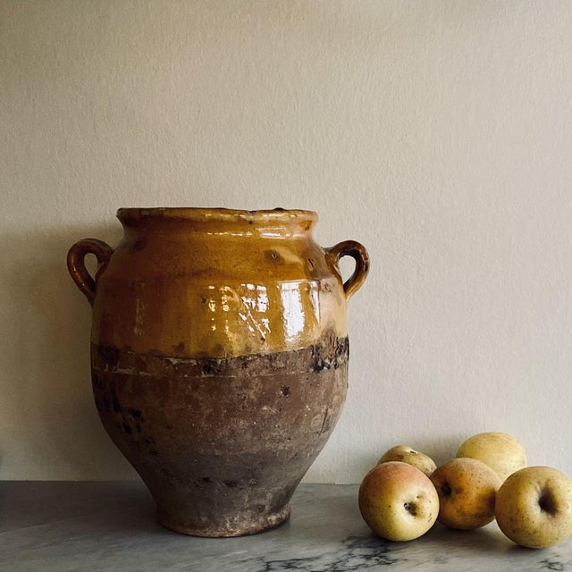 Antique yellow glazed grease pot. These pots were once used for preserving food and are now perfect for decoration,...