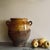 Antique yellow glazed grease pot. These pots were once used for preserving food and are now perfect for decoration,...