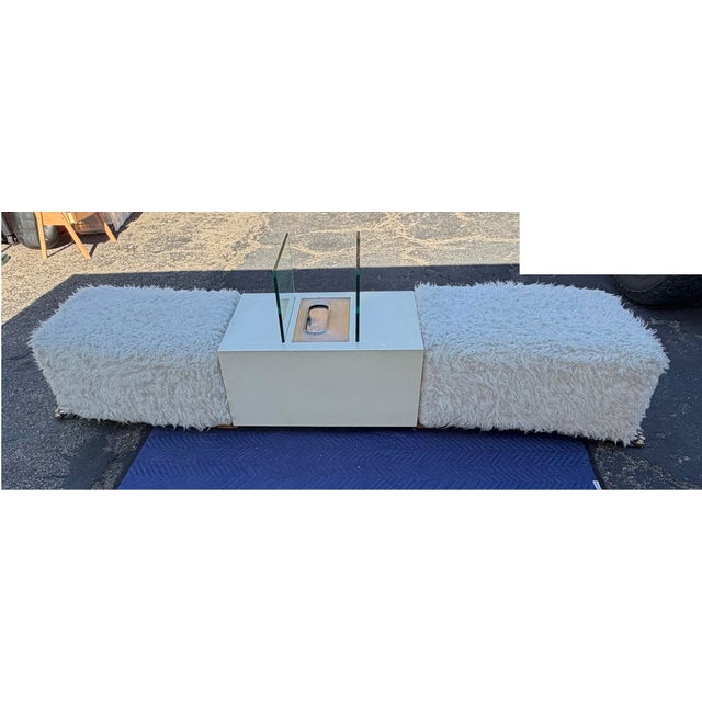 A glamorous statement bench with a built-in twist — plush white faux fur cushioning sits atop a wood base finished with...
