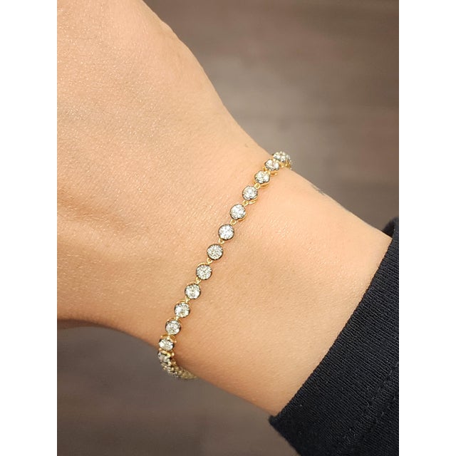 This elegant tennis bracelet is a masterpiece of modern design, crafted to captivate with its refined simplicity and...