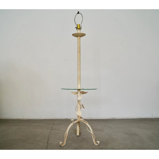 Vintage Hollywood Regency floor lamp for sale. Has an attached glass side table. It's beautiful, and in excellent...