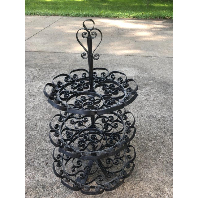 1950s Spanish cast iron ornate three tiered stand. Beautifully made with lots of details. Can be used inside or outside...