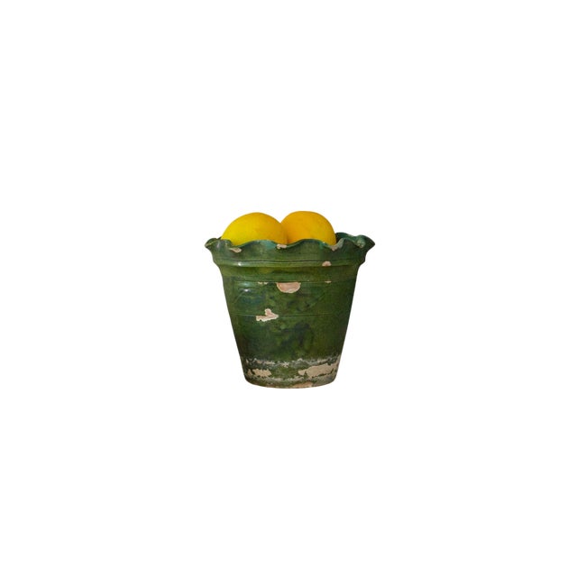 This green planter is a late 19th-century French glazed terracotta pot, often referred to as a Castelnaudary or Anduze...