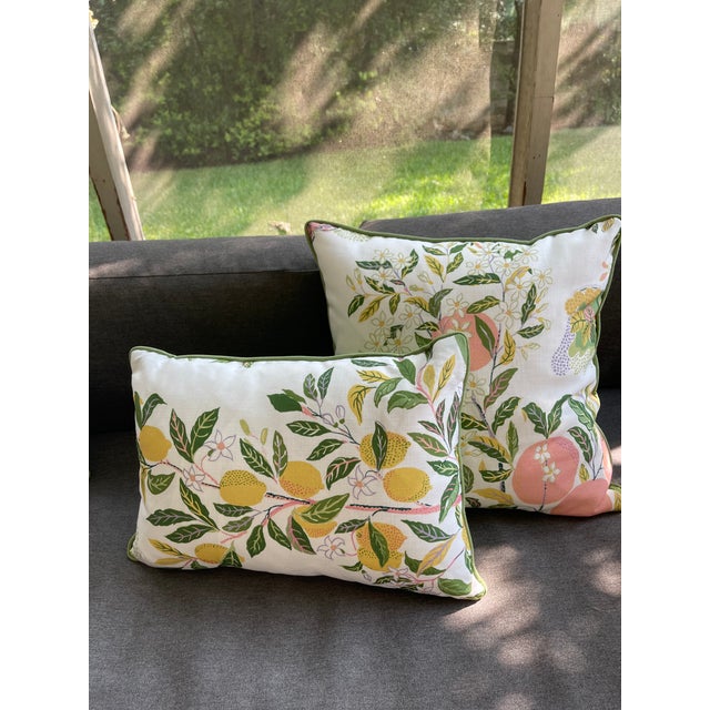 Schumacher's Citrus Garden outdoor pillows backed with Pindler outdoor Balboa Sprout Green fabric. Green welt cord too....