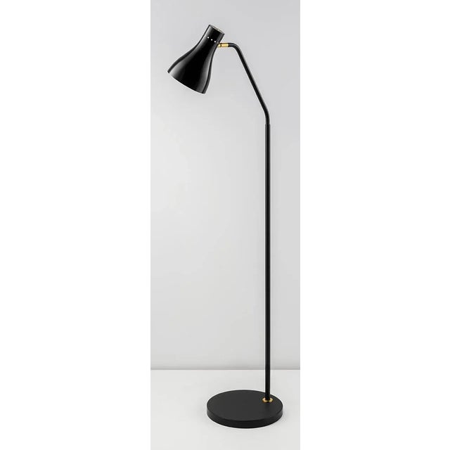 This Floor Lamp Features A Fully Adjustable Gloss Black Metal Shade Secured To The Arm With A Detailed Brushed Brass...