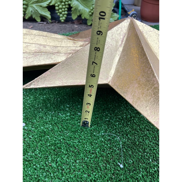 Up for consideration is a beautiful vintage paper mache light weight gold star. This is a fun accent that will brighten up...