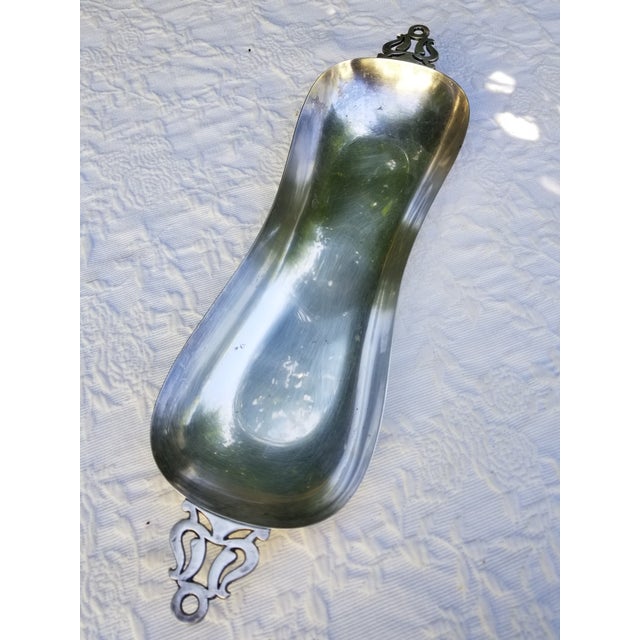 Elegant Long shape with Vintage handles makes this tray work with a lot of setting. The handles look like the kinds that...