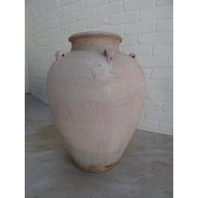 A beautiful terra cotta oil jar of large size from the mid 20th century.