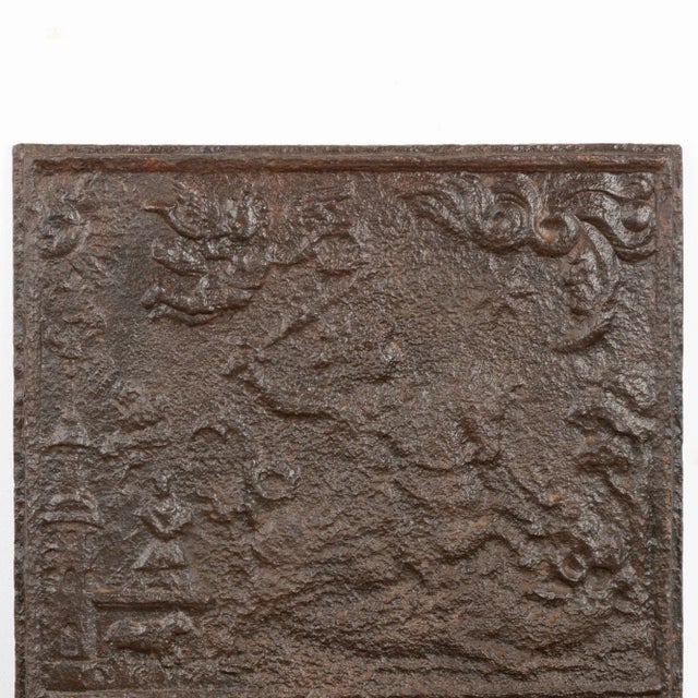 Cast iron fire back with soldier wielding sword on horseback and cherub with trumpet. All scratches, dings, abrasions,...