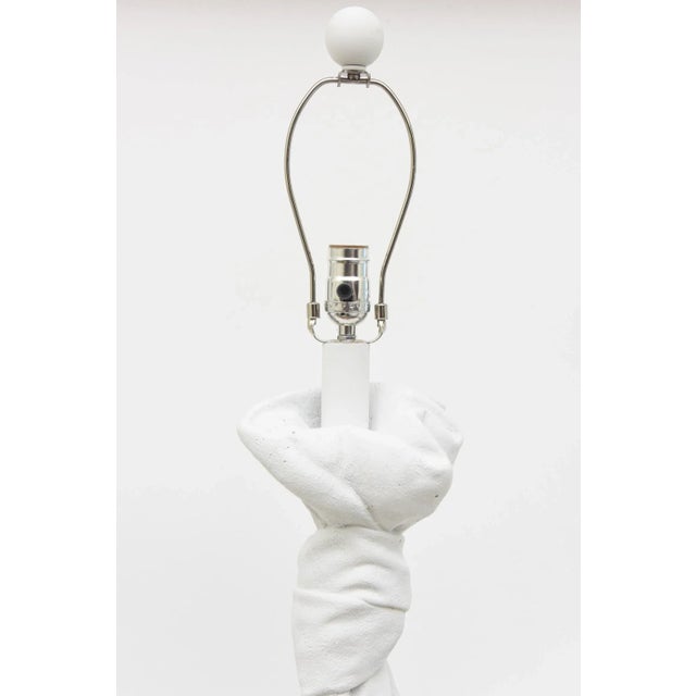 This pair of fully restored and re-painted vintage white Plaster of Paris draped and knotted lamps are in the style of...