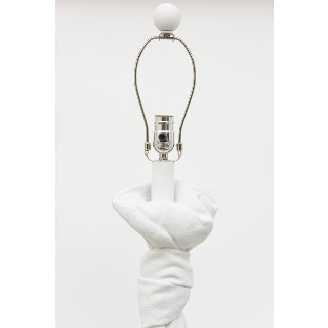 This pair of fully restored and re-painted vintage white Plaster of Paris draped and knotted lamps are in the style of...