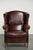 This stately sheepskin wingback chair features a beautiful, warm chestnut color and a comfortable seat. It comes with a...
