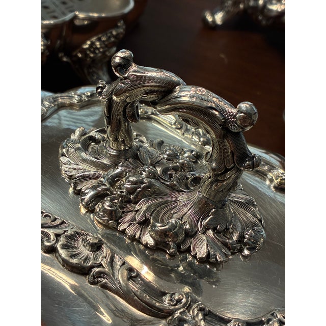 A pair of antique complete four-piece entre’e servers which also function as food warmers. These exquisitely crafted...