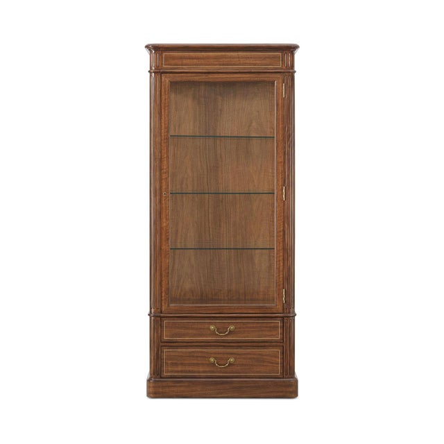 Drawing inspiration from classic Regency-era cabinetry, the piece is detailed with traditional reeded accents and finished...