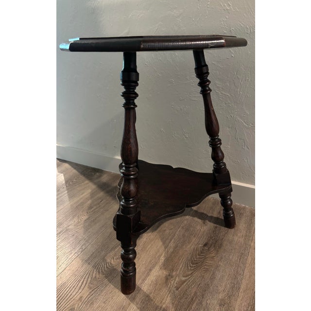 A particularly handsome 19th century English oak cricket table, distinguished by the gentle carving to its top—subtle yet...