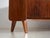 Mid-century sideboard veneered in walnut and raised on tapered legs, made in czechoslovakia around 1960. A mid-century...