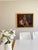 This substantial antique Orientalist oil painting on canvas presents an elaborate courtly interior centered upon a richly...