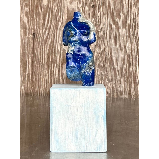 Celebrate the timeless beauty of the human form with this striking vintage carved stone sculpture of a female torso....