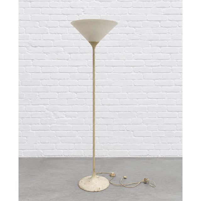 Mid Century Modern Italian torchiere floor lamp, c. 1960’s. Featuring a beautifully streamlined silhouette, slender...