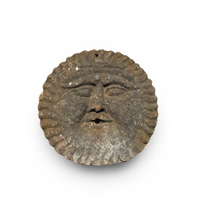 Charming 19th-century sandstone sculpture representing a stylized sun, originally designed as the wall outlet element for...