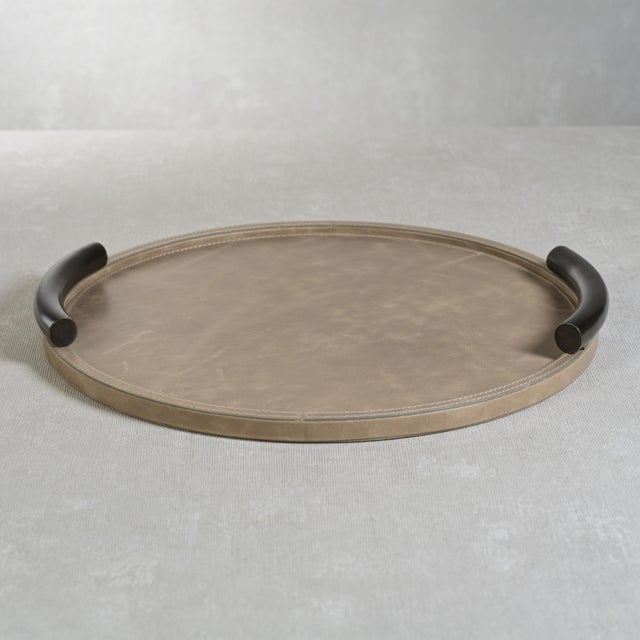A twist to a traditional tray, this sophisticated Cameroon Mink Leather Serving Tray is a well-made piece that will last...