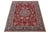 This stunning hand-knotted Isfahan wool rug features a vibrant red field adorned with beige and blue accents throughout...