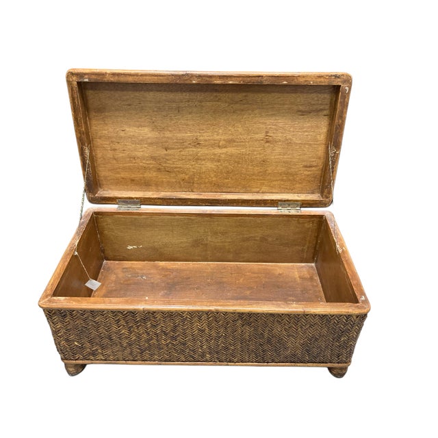 A richly textured woven rattan trunk crafted in the Philippines for Chambers Bed & Bath, c. 1990s. This versatile piece...