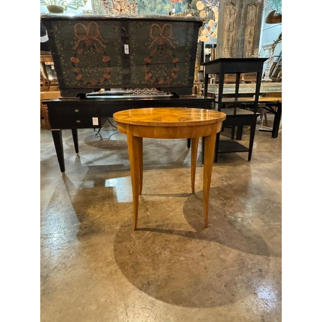This 19th-century German Biedermeier walnut table exudes a sense of timeless elegance and craftsmanship. With its rich...