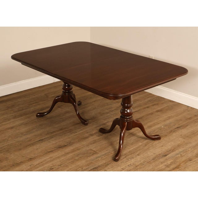 High Quality Vintage Cherry Expandable Dining Table Mounted on Two Carved Pedestal Bases, Includes Two Leaves and Table Pads