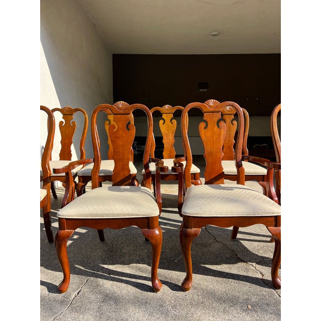 Set of 8 vintage Queen Anne–style dining chairs by Universal Furniture Ltd. Solid mahogany with a carved shell crest...