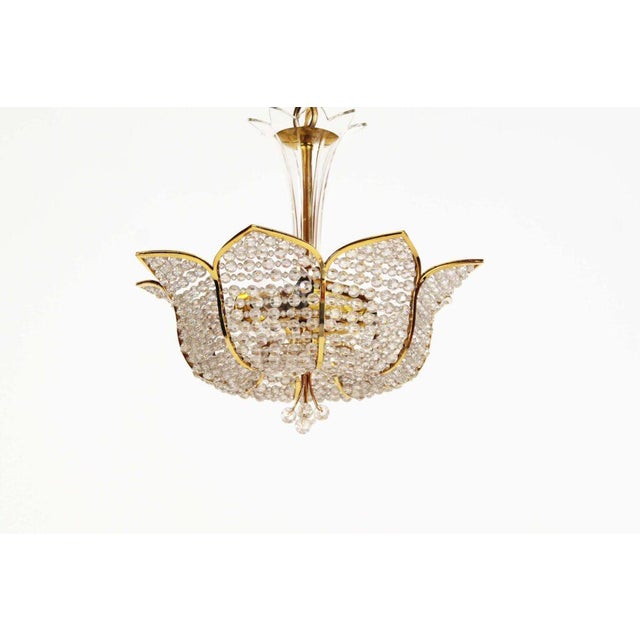 Stunning and high quality crystal and gilt chandelier by Palwa. In fabulous and undamaged condition, real heavy quality...