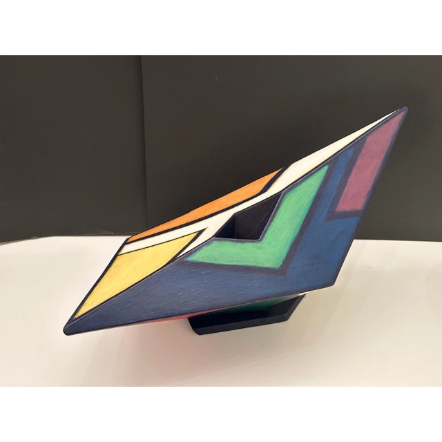 Beautiful colors on both sides of this three-dimensional sculpture made of clay and paint. One side features orange,...