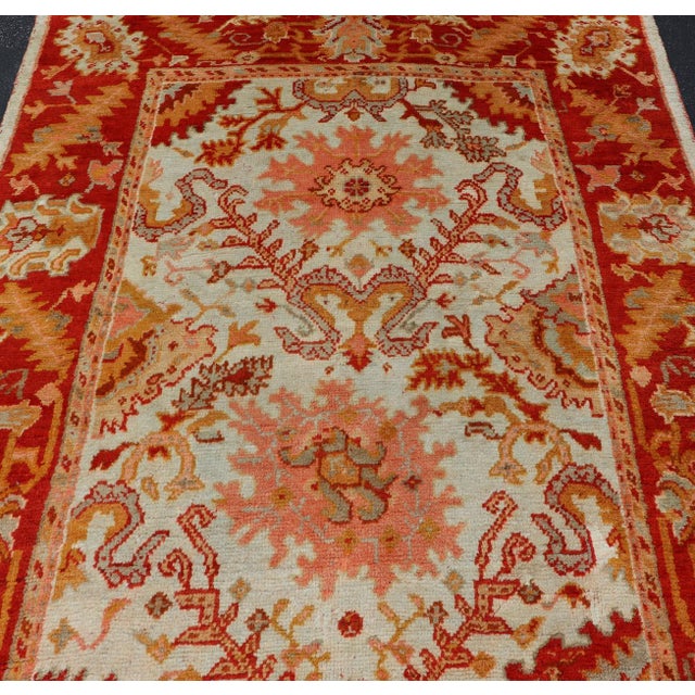 Early 20th Century Antique Turkish Oushak With Elegant Motifs in Red, Ivory, Gold and Salmon Pink 7 X 9'8 For Sale - Image 5 of 15