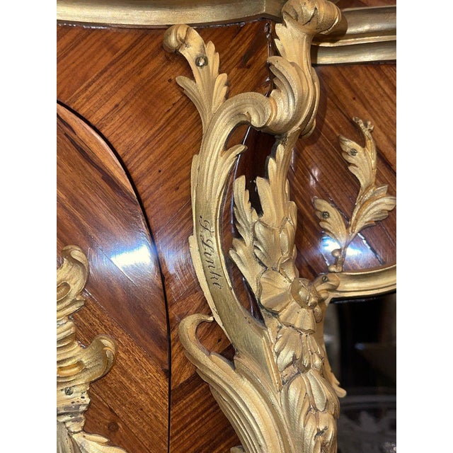 A museum-quality French Louis XV style vitrine of exceptional craftsmanship, bearing the signature of the celebrated...