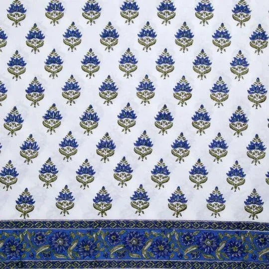 The Blossom design illustrates a traditional Indian flower motif set against a scrolling floral border for a beautiful...