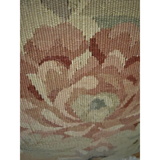 Pair of aubusson pillows bordered by fringe. Down feather inserts on both pillows.