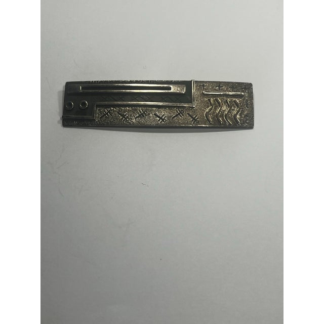 Native American brooch by Zuni silversmith Myron Panteah Composed of 14 karat gold and sterling silver Modernist elements...