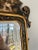 Italian, circa 1960. A well decorated black and gold chinoiserie decorated wall mirror in the chippendale taste. Mirror...