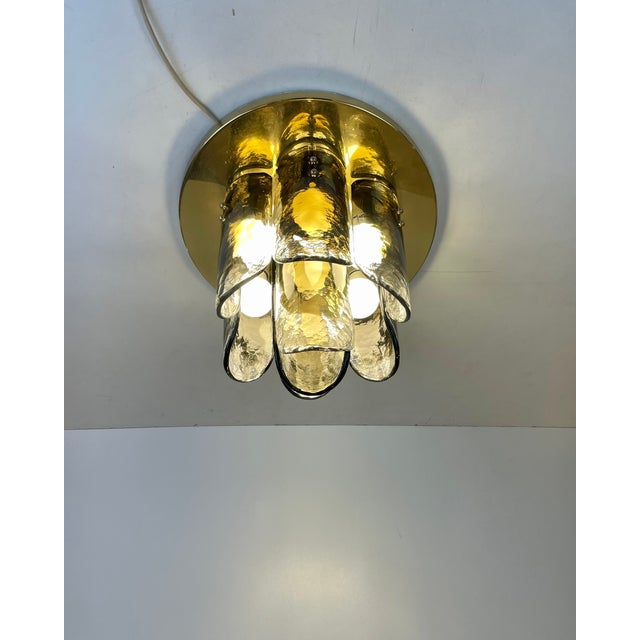 Beautiful ceiling lamp, flush-mounted, made of eight pieces of curved clear murano glass with dark cloud (which was...