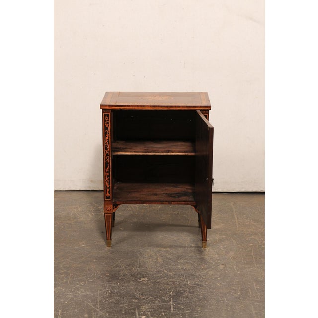 An Italian period Neoclassical small-sized comodino embellished with a beautiful foliate motif marquetry, from the early...