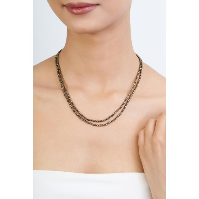 Add a distinctive touch to your jewelry collection with this 85-carat pyrite double-strand beaded necklace, designed with...