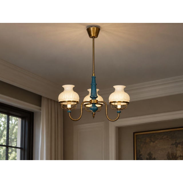 Swedish Mid-Century Modern, Pendant Light or Chandelier, Blue Lacquered Wood, Glass, Brass, Sweden, 1940s A lacquered...