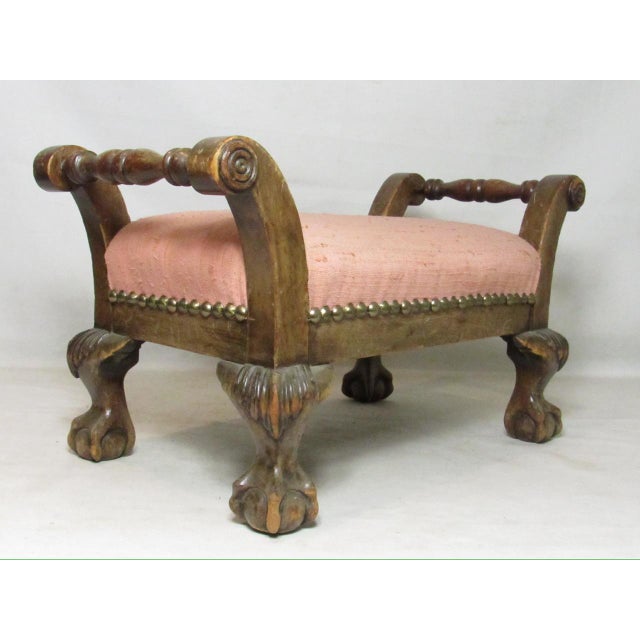 Antique English low foot stool, c.1900 A handsome looking small scale foot stool from walnut, having out swept scrolling...